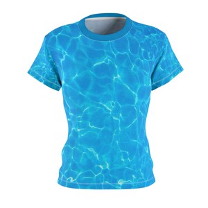 May include: A blue t-shirt with a water ripple pattern.