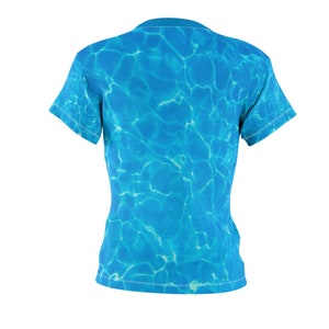May include: A blue t-shirt with a water ripple pattern.