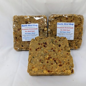 May include: Two packages of Rustic Bird Shop premium homemade no-melt suet in a hot pepper blend. The suet is a mixture of sunflower hearts, mixed nuts, spicy pepper, black oil sunflower, safflower, and corn.