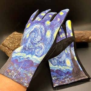 May include: A pair of gardening gloves featuring a print of Van Gogh's "Starry Night" painting. The gloves have a black palm and finger area, with the artwork covering the back of the hand and fingers. The artwork includes swirling blue, yellow, and white colors.