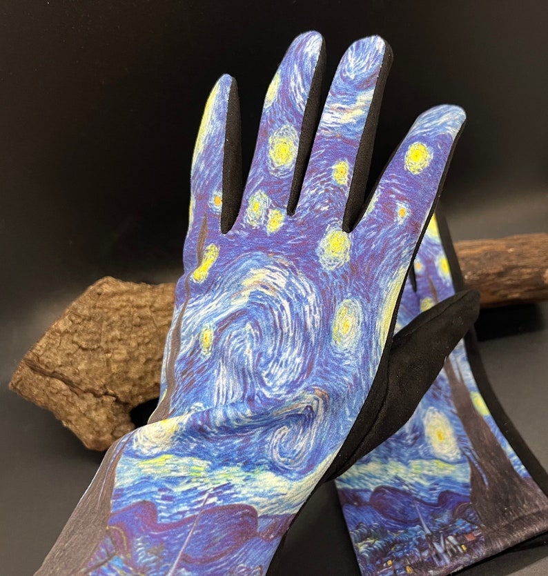May include: A pair of gardening gloves featuring a print of Van Gogh's "Starry Night" painting. The gloves have a blue and yellow swirling design with black accents on the fingers and cuffs. The gloves are designed for outdoor use.