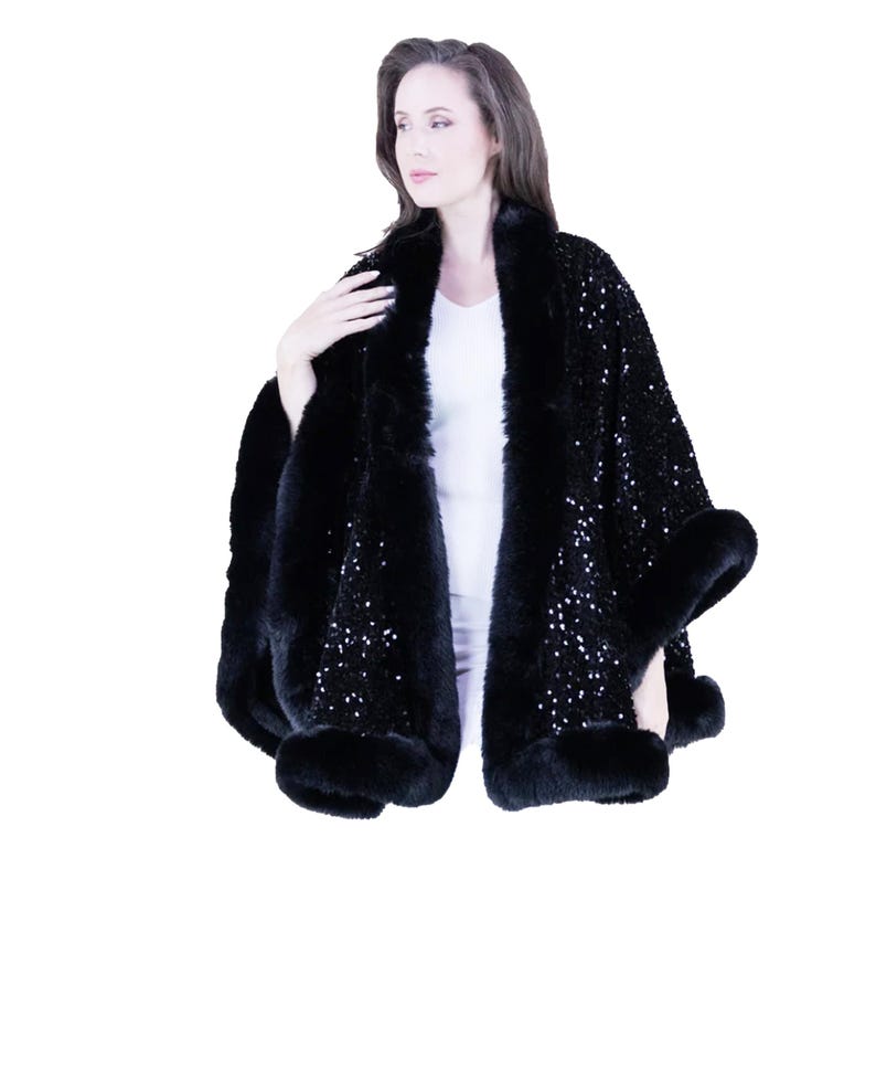 May include: A black sequined cape with a faux fur trim. The cape is worn by a model and has a shawl collar.