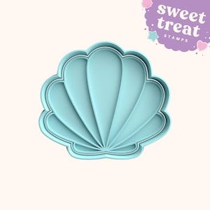 Juego de sellos y cortadores de fondant con forma de concha marina.