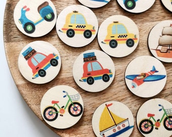 May include: Wooden circular toy pieces featuring various modes of transportation. The illustrations include a blue scooter, yellow taxi, red car, sailboat, airplane, and bicycle. The pieces are arranged on a wooden tray.