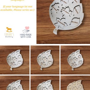 May include: A wooden leaf-shaped puzzle with 8 pieces, each piece representing a different type of tree. The pieces are labeled in German with the names of the trees: die Pappel, die Birke, die Buche, die Eiche, der Ahorn, die Kastanie, and die Ulme.