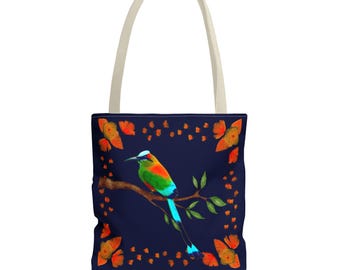 May include: A navy blue tote bag featuring a colorful bird perched on a branch. The bird has vibrant green, orange, and blue plumage. The bag has a cream-colored handle and is decorated with orange butterflies.
