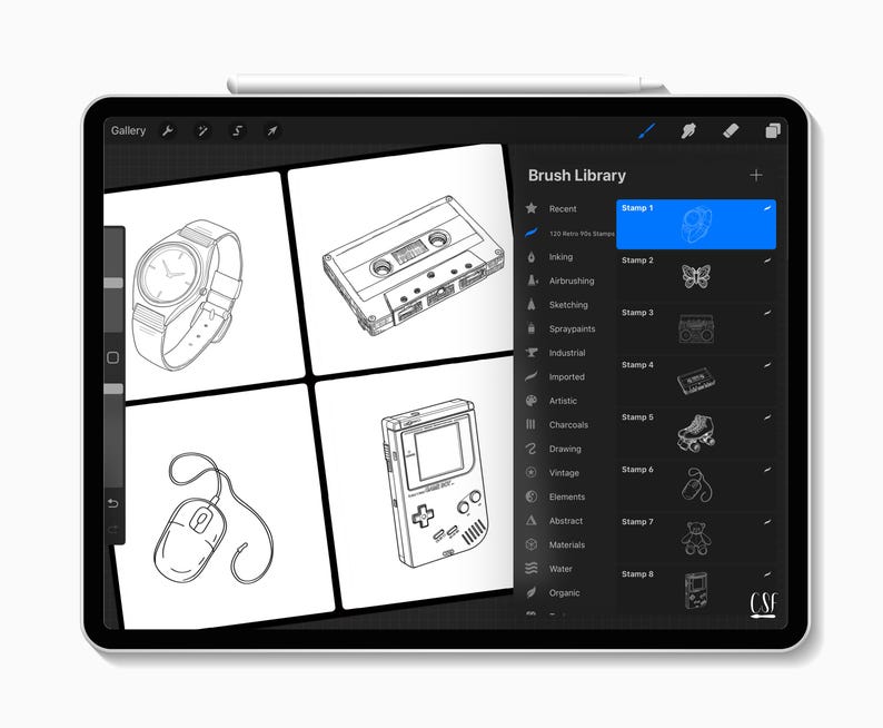 May include: A digital tablet displaying a drawing application interface. The screen shows black and white line drawings of a watch, cassette tape, computer mouse, and a handheld game console. The "Brush Library" panel is visible.