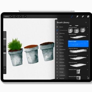 May include: A digital painting on a tablet shows three watercolor potted plants with soil and greenery. The tablet's screen displays the Procreate app with the Brush Library open, highlighting the "Soil" brush.