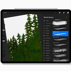 May include: A digital painting of evergreen trees on a tablet screen. The artwork is in shades of green and white, with a focus on the texture of the foliage. The tablet's "Brush Library" is open, showing various brush options for digital art.