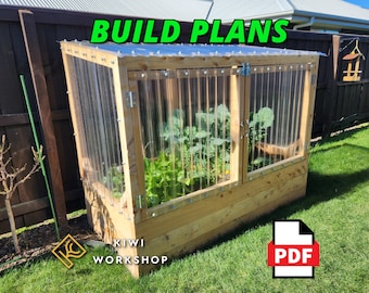 May include: A wooden raised garden bed with a clear plastic roof and two doors. The bed is filled with plants and the text "BUILD PLANS" is written in green letters above the bed. The text "KIWI WORKSHOP" is written below the bed. A PDF icon is in the lower right corner of the image.