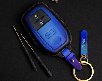 May include: A blue leather key fob with a key chain and a tag that says "FUNK".
