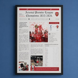 May include: Framed print celebrating Arsenal's Premier League victory in 2025/2026. The design resembles a newspaper front page, featuring headlines, team photos, and the score of the final match. The print is in a black frame.