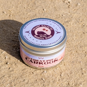 May include: A silver tin candle with a purple label that reads "Valiant Galactic Space Tourism" and "The Great Pit of Carkoon".