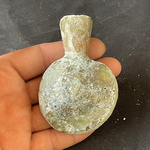 Beautiful Ancient Roman irdescent glass  bottle in good condition