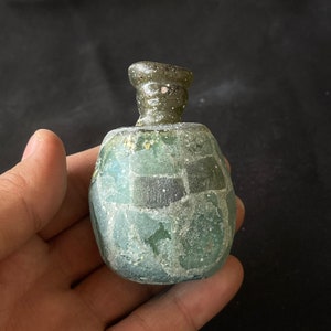 Wonderful ancient Roman irdescent glass unique bottle with lovely Patina