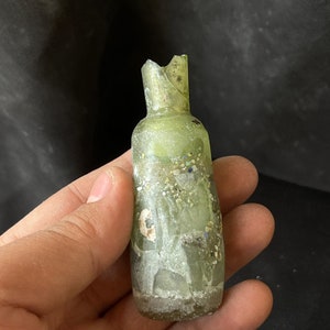 Wonderful ancient Roman irdescent glass unique bottle with lovely Patina