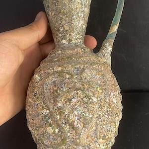A perfect condition Ancient Roman iridescent glass large pitcher vase with patina