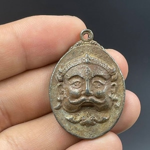 Ancient near Eastern bronze face engraved amulet pendant