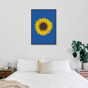 May include: A single sunflower with yellow petals and a brown center is depicted against a solid blue background. The sunflower is centered in the image.