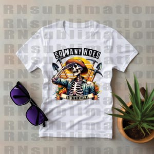May include: White t-shirt with a graphic of a skeleton holding a shovel and the text "So Many Hoes So Little Time".