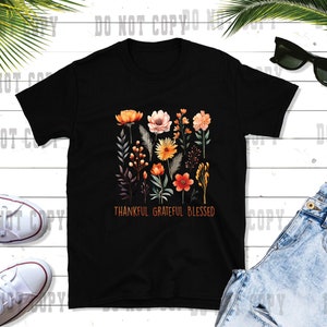 May include: Black t-shirt with a floral design and the text "Thankful Grateful Blessed".