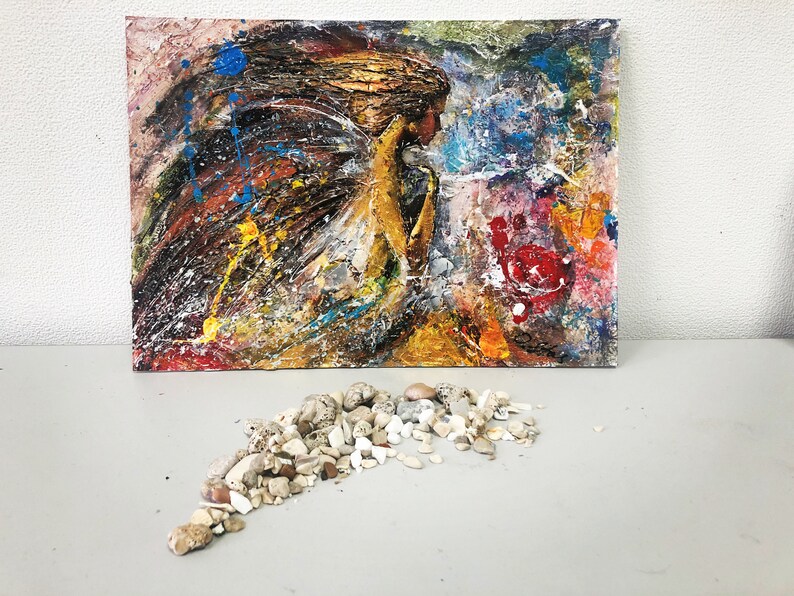 May include: Abstract painting on canvas with a textured surface. The painting features a figure with flowing hair and a colorful background with splashes of blue, yellow, red, and white paint.