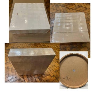 May include: Three cardboard boxes wrapped in brown packing tape. The boxes are different sizes and shapes. One box has a round wooden top with a handwritten label that says "Lego Room 2023"