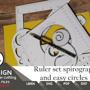 May include: A set of white plastic rulers and stencils for drawing circles and geometric shapes. The set includes a protractor, a ruler with inches and centimetres, and a spirograph-style gear template. The set is designed for laser cutting.