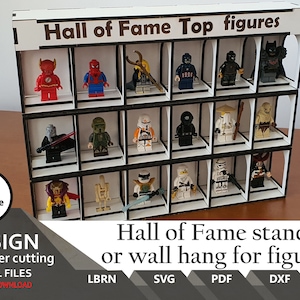 May include: White wooden display stand with black trim for holding small figurines. The stand has 18 compartments and the text "Hall of Fame Top figures" is printed on the top.