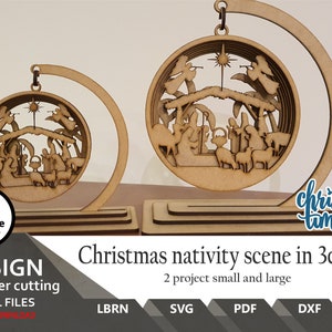 May include: A laser cut wooden Christmas nativity scene in a 3D ball ornament. The ornament is on a stand and there is a smaller version of the ornament next to it. The text "Christmas time" is written in blue cursive on the image.