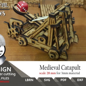 May include: A detailed wooden medieval catapult model, designed for laser cutting. The image includes the text "Medieval Times" and "Creative Vector". The catapult is scaled at 28 mm for 3mm material. A red die sits in the spoon. Digital files are available.