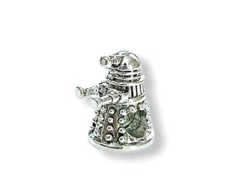 May include: Silver charm shaped like a Dalek, a fictional robot from the British science fiction television series Doctor Who.
