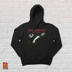 May include: Black hooded sweatshirt with a graphic print of The Smiths album cover "The Queen Is Dead".
