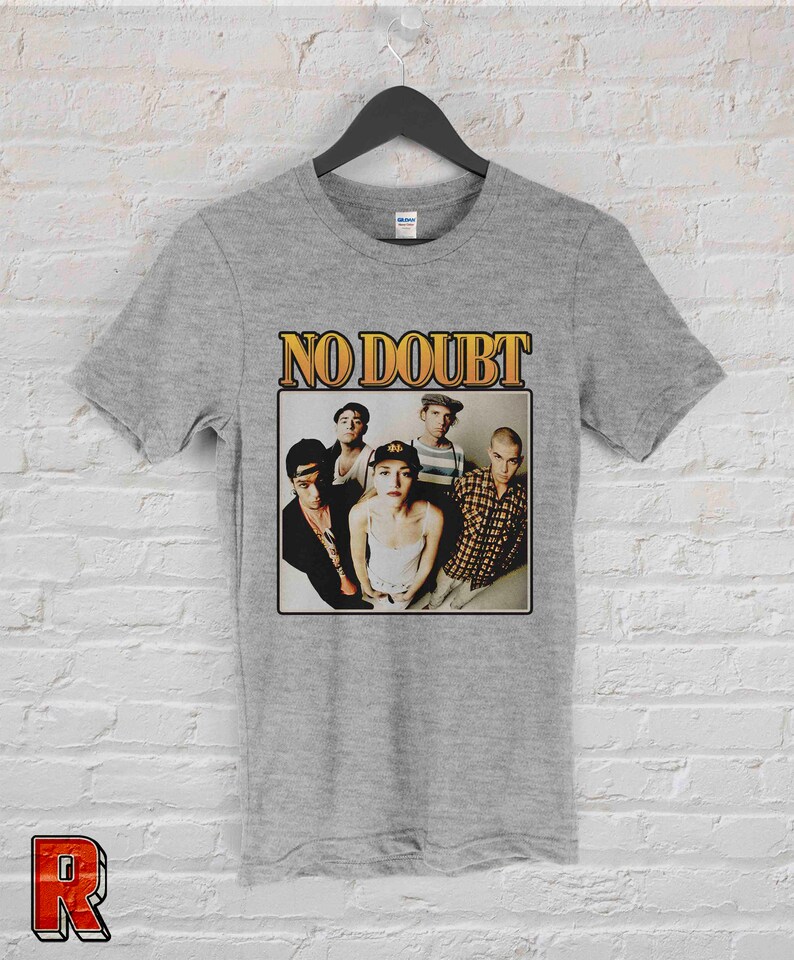May include: Gray t-shirt with a vintage-style graphic of the band No Doubt. The graphic features a photo of the band members, including Gwen Stefani, in a black and white photo.