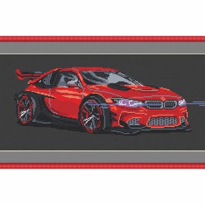 May include: A red sports car with black accents and a large spoiler. The car has a black grille with a silver emblem and large black wheels.
