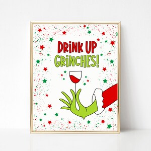 May include: A white printable sign with green and red stars and the text "Drink Up Grinches!" with a green hand holding a glass of red wine.