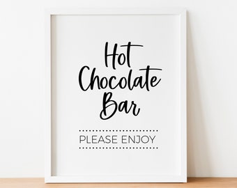 May include: White framed sign with black text that reads "Hot Chocolate Bar" and "PLEASE ENJOY" in a dotted line.