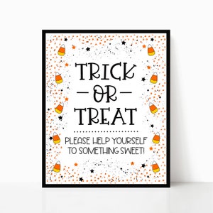 May include: A white sign with black text and a black border. The sign says "Trick or Treat" and "Please help yourself to something sweet!" The sign is decorated with orange and yellow candy corn and black stars.