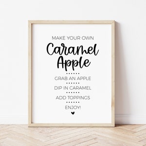 Make Your Own Caramel Apple sign. Instructions include: Grab an apple, Dip in caramel, Add toppings, Enjoy! Modern minimalist design. A line of 6 black dots separate each instruction. Small black heart at the bottom.