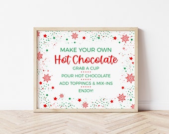 May include: A printable sign with a white background and red and green snowflakes and stars. The sign says "Make Your Own Hot Chocolate" and includes instructions to grab a cup, pour hot chocolate, add toppings and mix-ins, and enjoy.