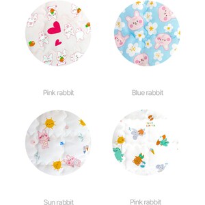 May include: Four different fabric swatches with various patterns featuring pink rabbits, blue rabbits, and sun rabbits. The swatches are labeled "Pink rabbit", "Blue rabbit", "Sun rabbit", and "Pink rabbit".