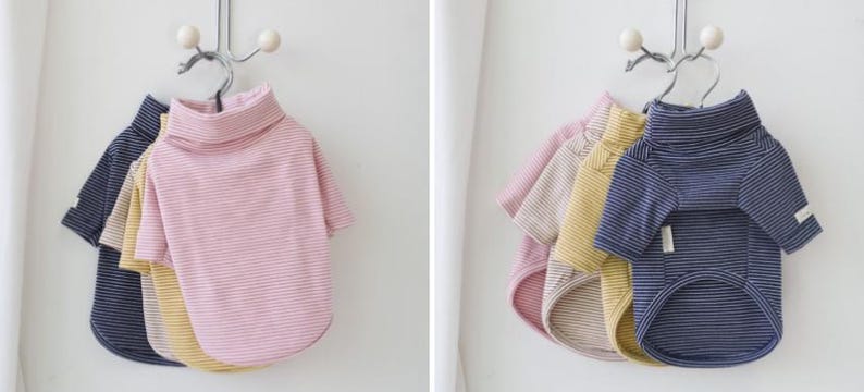 May include: Three striped turtleneck shirts for pets, one pink, one yellow, and one blue.
