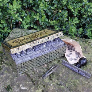 May include: A set of three ceramic mugs with a speckled, matte finish. The mugs are in shades of cream, light gray, and dark gray. Each mug has a simple, minimalist design, perfect for coffee or tea.