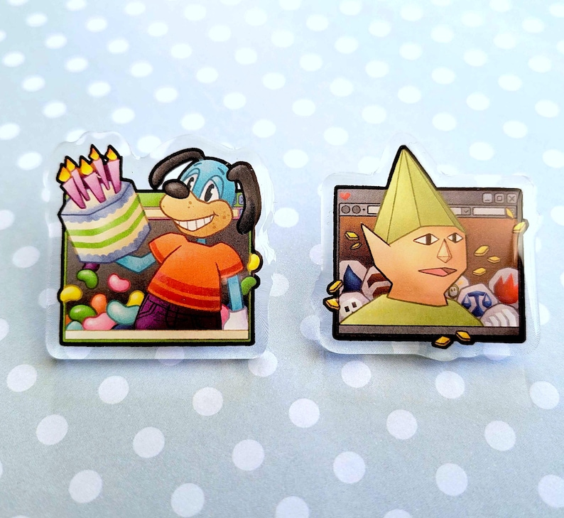 May include: Two cartoon-style stickers. One features a blue dog holding a birthday cake with candles, wearing an orange shirt and purple pants. The other shows a green-clad elf-like character in front of a computer screen. Both stickers have a clear border.