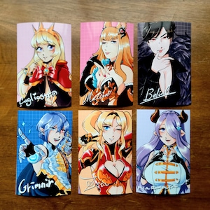 May include: Six illustrated cards featuring anime-style characters. Each card has a different character with a unique design and name. The characters are depicted in various poses and expressions. The cards are printed on a white background with a grid pattern.