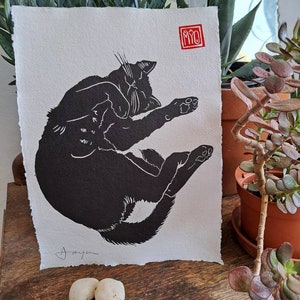 Snoozing Black Cat. Gorgeous hand printed linocut of a cat dozing on a lazy morning. Print on A4 (8.5" x 12") hand-made paper.