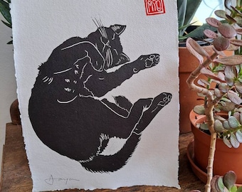 Snoozing Black Cat. Gorgeous hand printed linocut of a cat dozing on a lazy morning. Print on A4 (8.5" x 12") hand-made paper.
