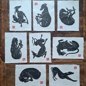 All 8 of my A4 size, hand printed, linocut longdogs, greyhounds, lurchers, whippets.