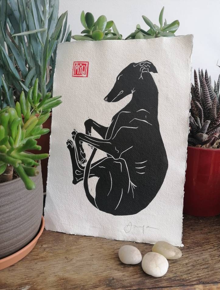 Dreaming long dog, hand-printed linocut.