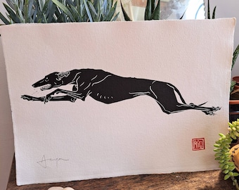Zoomies 2. A3 (16.5" x 11.5") Handmade linocut print of a joyful, running hound. Perfect gift for greyhound, whippet and lurcher lovers.